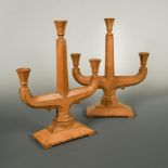 A pair of Cotswold School sycamore three-branch candelabra, each with octagonal section trumpet