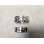 Liberty & Co., two similar silver and enamel napkin rings Birmingham 1912, each of circular form,