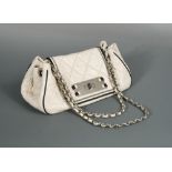 Chanel, a ladies 'East West' Accordion Flap bag, circa 2008, ivory quilted lambskin with black