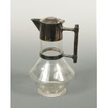 Attributed to Christopher Dresser, an electroplate and glass claret jug, by William Hutton & Sons,