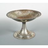 An Arts & Crafts silvered copper punch bowl, the circular bowl with rope-twist border on a spreading