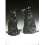 An Irish Terrier cast iron doorstop and another cast iron dog doorstop (2)