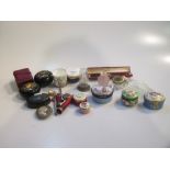 A collection of small enamel boxes including one 19th century with painted lid, a rose quartz