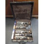 LeBlanc Paris, a pair of ebonised wood cased clarinets, 20th century