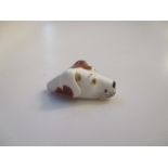 A miniature 19th century porcelain dogs head whistle