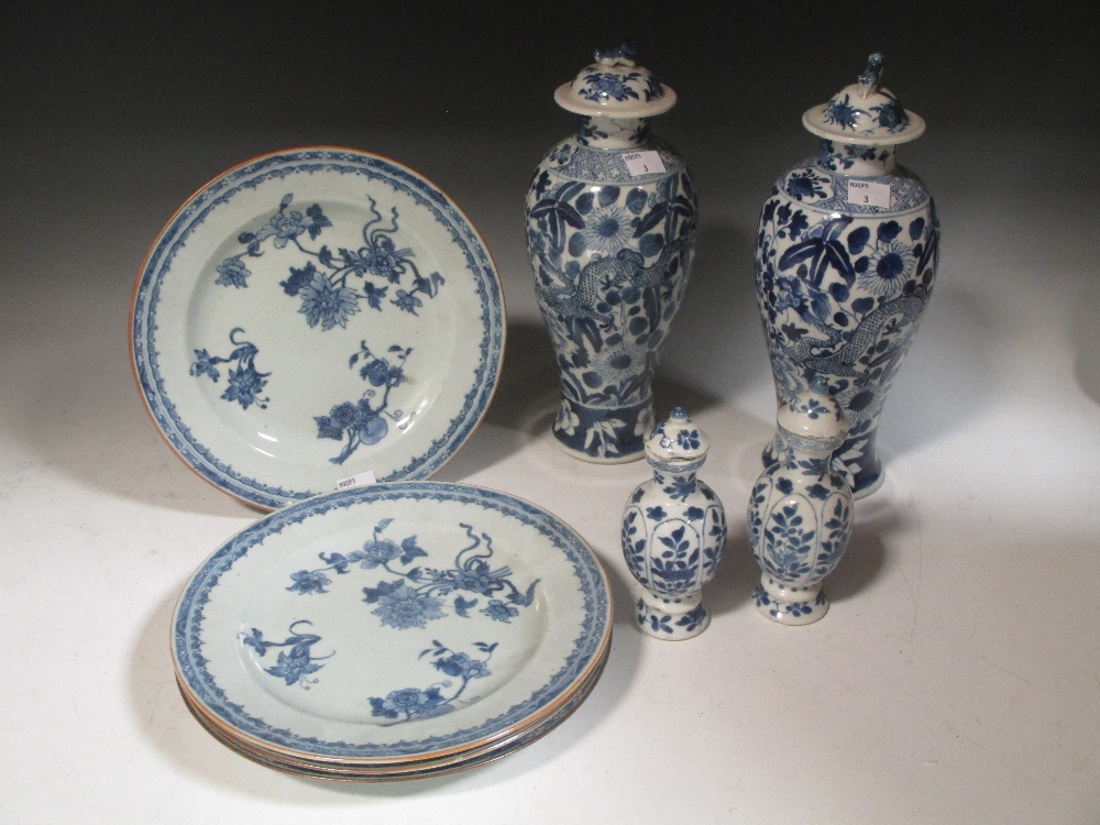 Four Chinese blue and white late 18th century export plates, a pair of blue and white vases and a