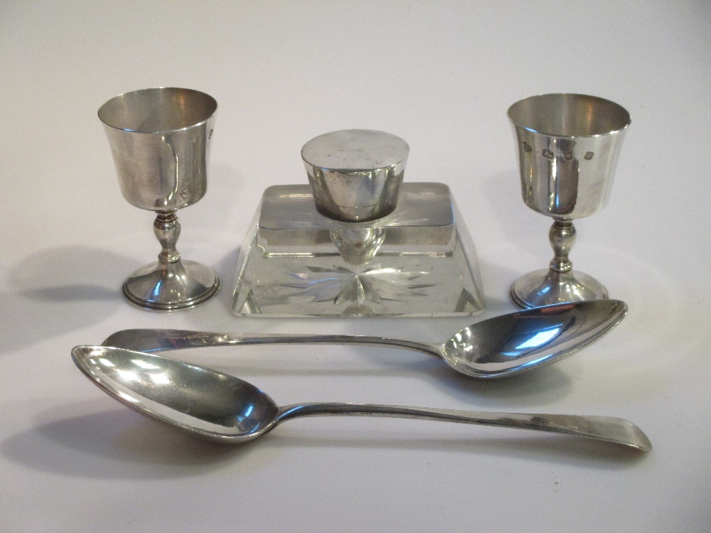 A pair of modern silver miniature goblets; a silver lidded Art Deco inkwell; a pair of George III