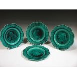 A set of four green ground majolica plates by Rubelles