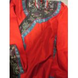 A Chinese red and silk patterned lady's robe, probably 1930s