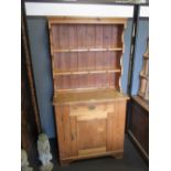 A pine cupboard with later plate rack, 183 x 91 x 42cm