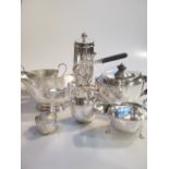 A three piece silver tea set, a silver sauce boat and a silver napkin ring, 26ozt gross, together