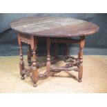 A 17th century oval gateleg drop leaf table with blind end drawer, on joint legs, 73 x 111 x 123cm