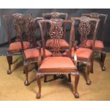 A set of eight George III style carved hardwood dining chairs, including two elbow chairs, 105cm