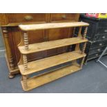 A mid 19th century continental four tier graduated wall shelf with bobbin supports 85 x 113 x 20cm