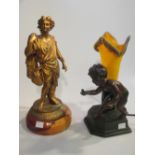 A modern bronzed figural lamp, another lamp and a statue (3)