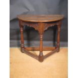 A 17th century oak Credence table, with shallow chip carved freizes on joint legs, 91cm wide