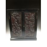 A Chinese panelled cabinet 52 x 47 x 24cm
