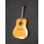 An acoustic guitar by Egmond, with soft case