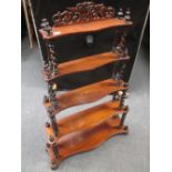 A Victorian rosewood three tier graduated shelf with twist turned supports, 105cm x 71 cm wide (