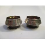 A pair of miniature salt pots marked to the base 'Tiffany & Co Sterling Silver' numbered 3402 4606