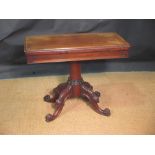 A William IV rosewood pedestal card table, with green baize lined interior, on leaf and scroll