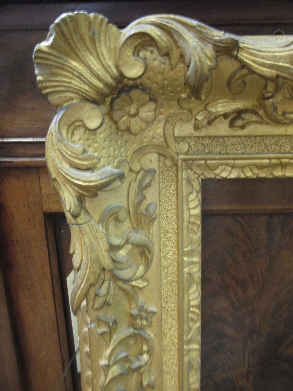 A gilt and gesso moulded picture frame, sight size 75 x 62cm