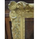 A gilt and gesso moulded picture frame, sight size 75 x 62cm