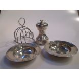 A silver pepper mill, two small armada dishes and a toast rack (4)