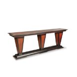 A large contemporary triple pedestal mahogany and ebonised console table, the three tapering