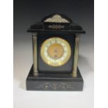 A late 19th century French black marble cased mantle clock