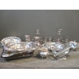 A quantity of silver plated wares including two pairs of candlesticks, several entree dishes, a