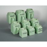 A comprehensive suite of Bristol Kitchen Ware by Pountney & Co., the sage green storage jars of