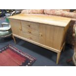 A mid century Gordon Russell sideboard, with a 'Russell of Broadway' plaque on reverse, 86 x 141 x