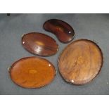 A George III mahogany oval tea tray and three further small trays, 70cm wide (largest) (4)