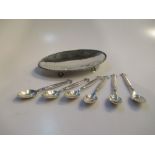 Six Danish silver coffee spoons in the manner of Jensen, and an Arts and Crafts style silver oval