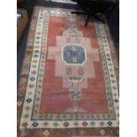 A Kazak style rug with plain field 190 x 124cm