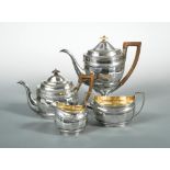 A George III silver harlequin 4 piece tea set, of oval fluted form with bands of bright cut engraved
