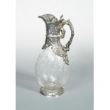 A Victorian silver claret jug, by Charles Edwards, London 1899, of pear shaped form, the glass
