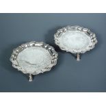 A pair of George II circular silver waiters by Samuel Courtauld, London 1751, 'Chippendale' style,