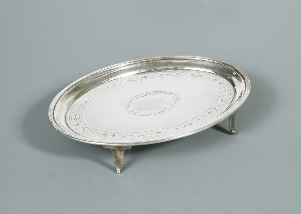 A George III teapot stand, by William Bennett, London 1804, of oval form, the field bordered by