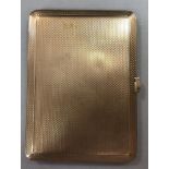 A 9ct gold pocket cigarette case by Mappin & Webb, bevel edged and engine turned all over with
