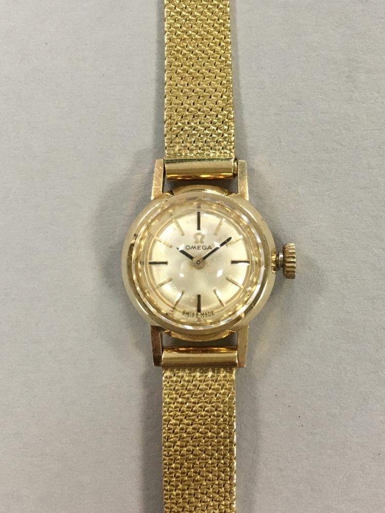 Omega - a lady's 14ct gold wristwatch, circa 1966, the circular signed dial with baton markers,