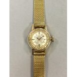 Omega - a lady's 14ct gold wristwatch, circa 1966, the circular signed dial with baton markers,