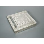 A Middle Eastern box, of square form, heavily decorated all over with symmetrical engraving in the