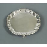 A George II silver waiter, by William Peaston, London 1747, with shell and scroll rim around the