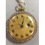 An unsigned continental open faced pocket watch, the gilt engine turned dial with black Roman