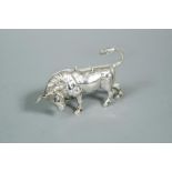 A continental bull in the style of a novelty cow creamer, the detailed cast body with hinged