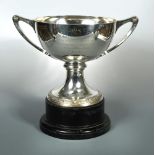 A George V silver large two handled cup, by Mappin & Webb, London 1930, the circular pedestal foot