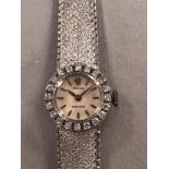 Rolex - A lady's 18ct gold precision dress watch, circa 1965, the circular signed cream coloured