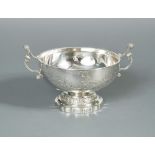 An 18th century French silver two handled wine bowl, maker's mark K.G, Paris 1750, of circular